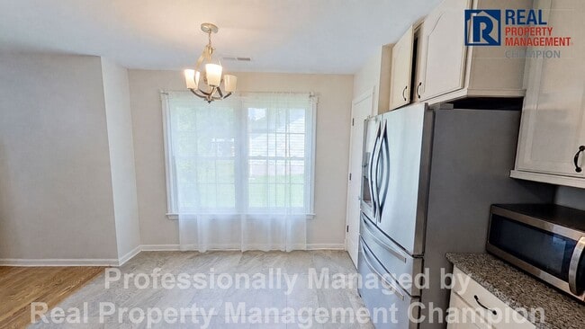 Photo - Charming home with open floor plan, vaulted ceilings and spacious backyard