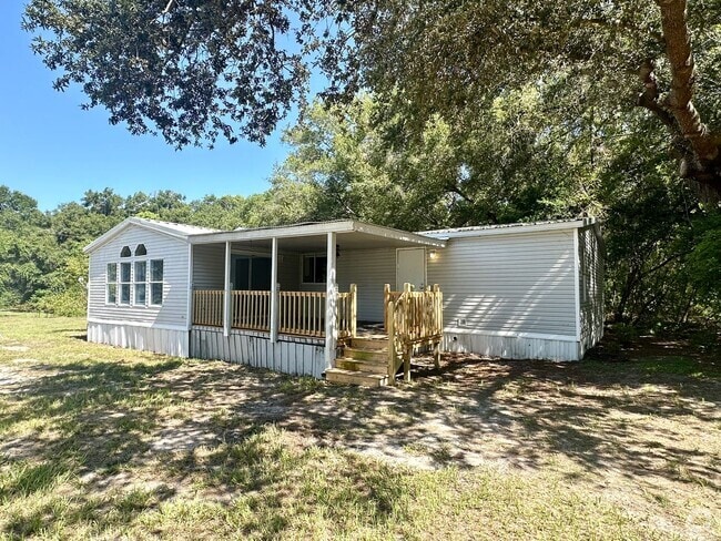 Building Photo - Privacy and Space in this 3/2 Home at the ...
