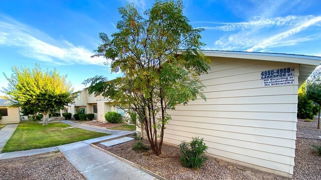 Building Photo - Great 3 bedroom and 1.5 bath townhouse with a small yard and 2 car garage.