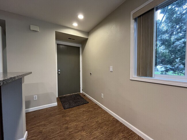 Photo - Ground Floor End Unit on Jantzen Beach with River Views & Flexible Living Space