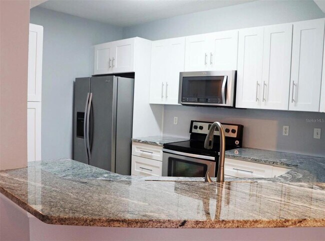 Photo - 5530 Metrowest Blvd Unit 210