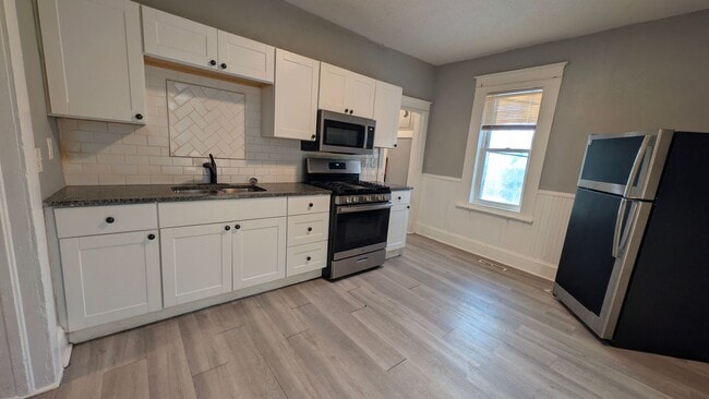 Photo - Come home to this great single family home with tons of charm and a beautiful yard