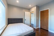 Experience comfort and style in this beautifully designed bedroom space.