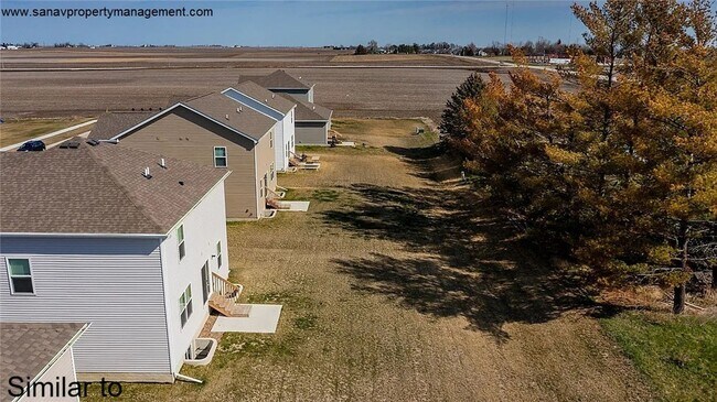 Photo - "Ankeny Oasis: Luxurious 4-Bedroom Home with Expansive 3-Car Garage and Secluded Backyard Retreat!"