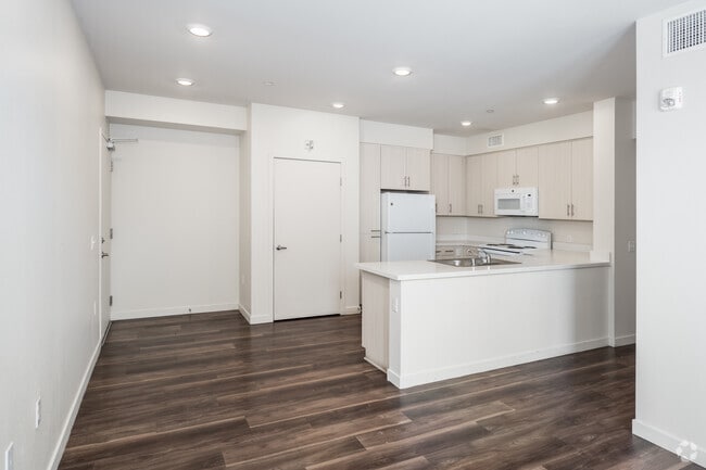 4BR, 2BA - 1,104SF - Kitchen and Living Room