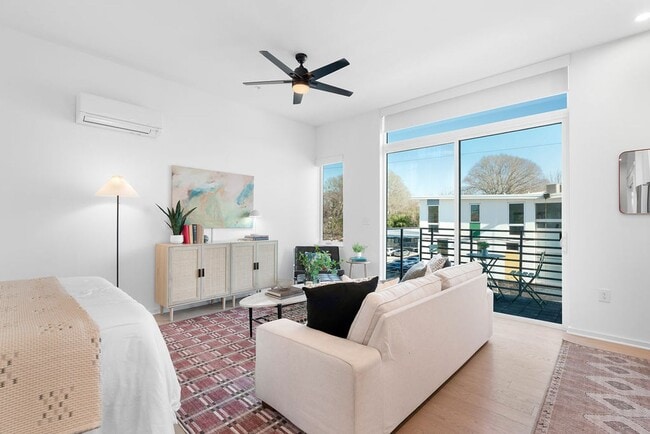 Photo - Modern downtown condo studio with private balcony & parking space.