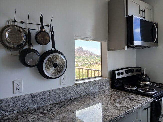 Newly remodeled kitchen peep view of Diamond Head - 2916 Date St Unit Fairway House