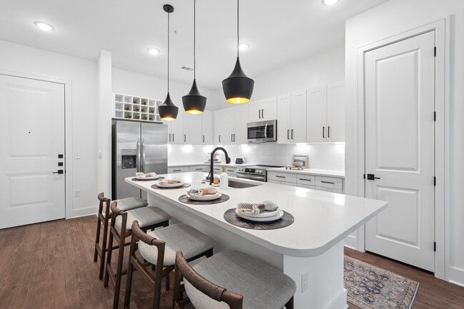 Kitchen with Quartz Countertop and Stainless Steel Appliances - Forayna Davis Park