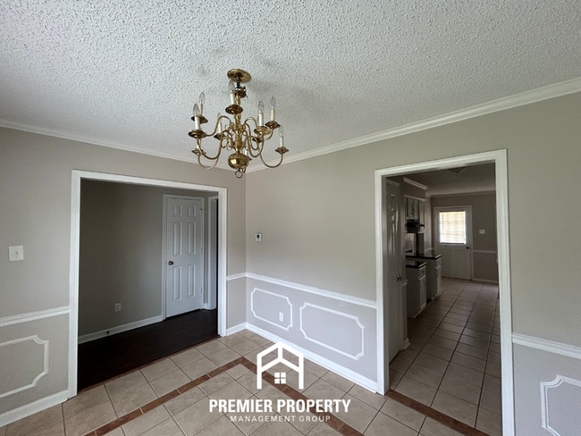 Photo - Spacious 4BR/2BA Near Southwind | High Ceilings, Brick Fireplace & 2-Car Garage