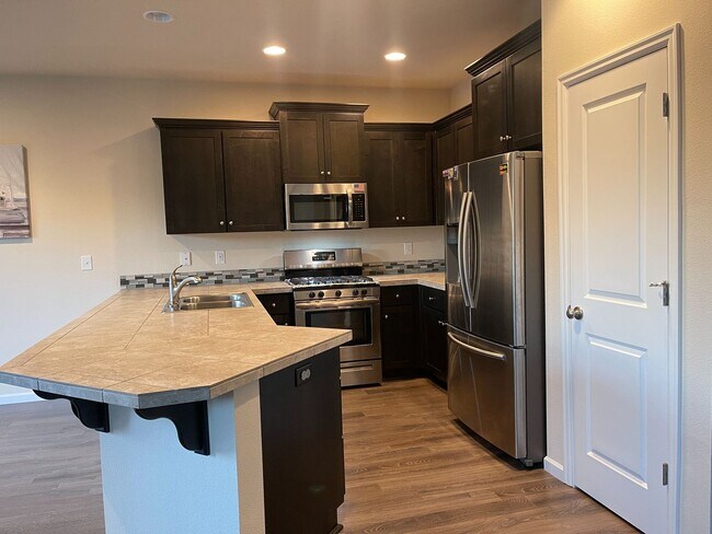 Photo - South Creek Meadows 4 BR Home with Den, Gas Fireplace & Attached 2-Car Garage