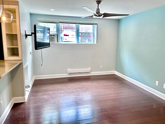 Living room, wall-mounted TV included - 2339 40th Pl NW Unit 4