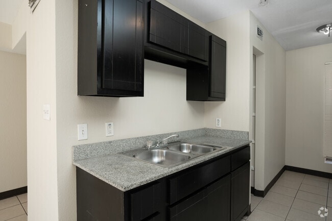 1BR, 1.5BA - 875SF - Kitchen - Sunshine Village Apartments