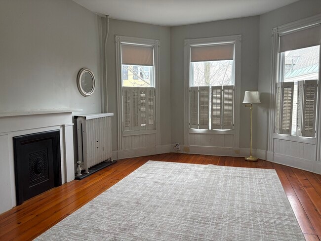 Spacious living room with bay windows - 24 Front St Unit Apartment 1