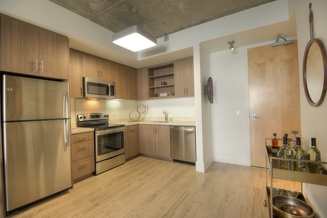 Stylish kitchen with stainless steel appliances and quartz countertops - The Gantry