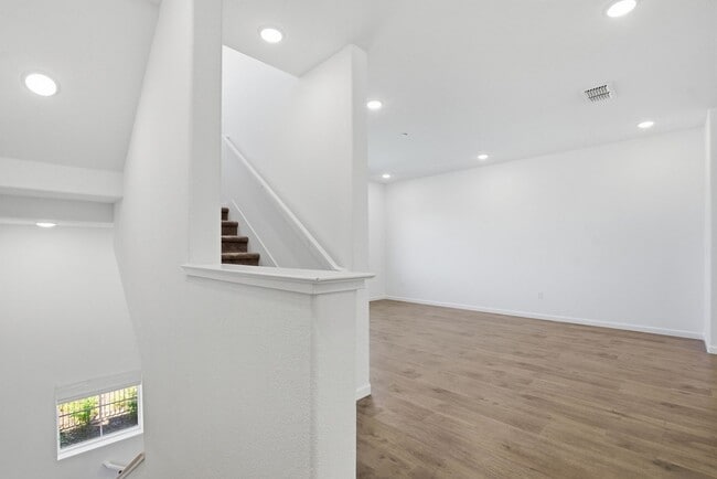 Photo - Spacious 3 Bed Townhome with Garage, A/C & Modern Finishes