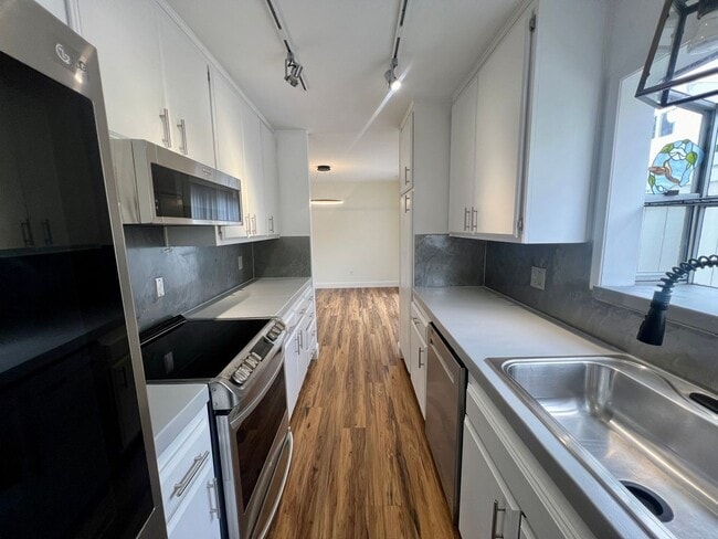 Photo - TWO PARKING SPACES INCLUDED! In Unit Washer & Dryer! Large Private Patio for Bikes, Boards and Bb...