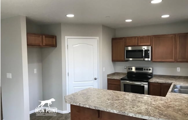 Photo - 3bed/2bath - Landscaping Included plus fenced yard, & two car garage.