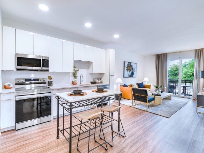 Experience culinary excellence in Modera Montville's gourmet kitchens, adorned with sleek quartz countertops and stylish tile backsplashes.