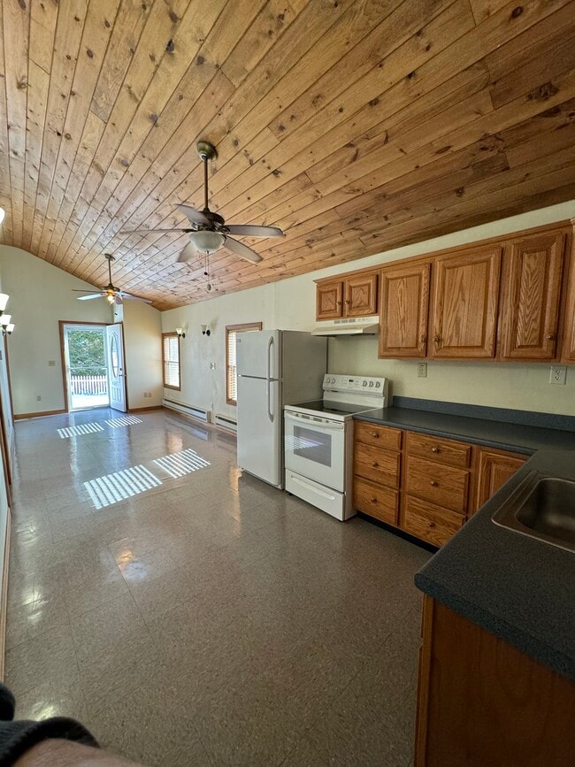 Kitchen w/ stove and refrigerator