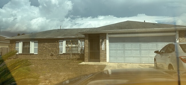 Building Photo - 1049 SW Aswan Ave