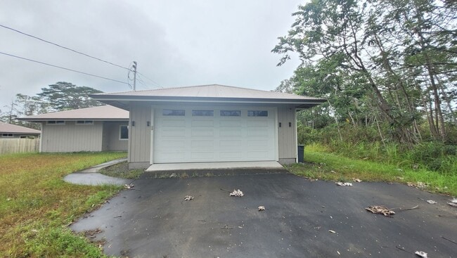 Building Photo - This 3-bedroom, 2-bath home in Orchidland Subdivision