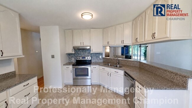 Photo - Charming home with open floor plan, vaulted ceilings and spacious backyard