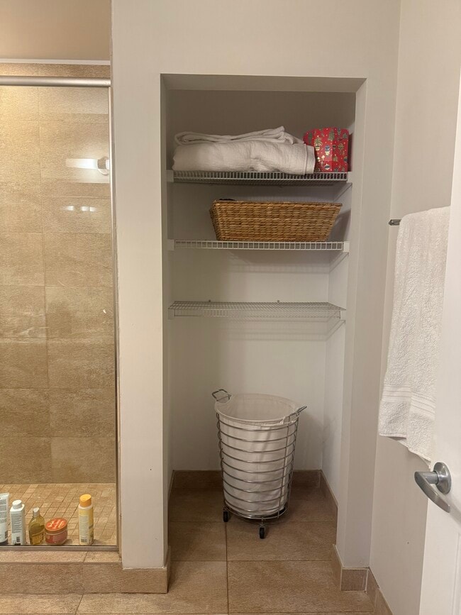 one of two linen closets in master bath - 525 Kedzie St Unit South Evanston Apartment