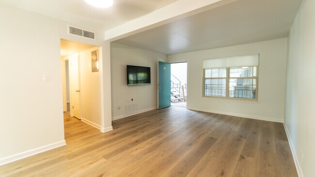 Spacious living area prewired to hang your TV. - 300 Crockett St Unit Apt 214