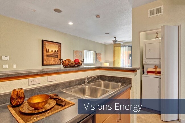 A kitchen with a view into the living room - Visions