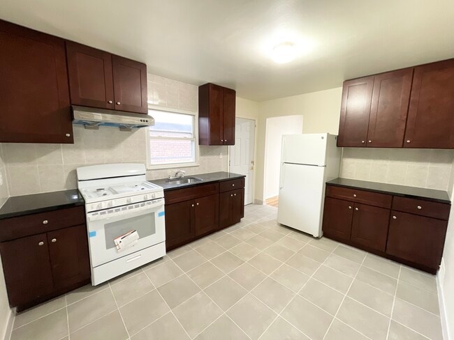Updated kitchen w/ new appliances - 43-11 172nd Street Unit House