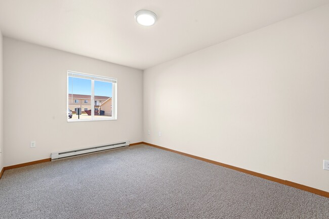 Step into the spacious interiors of Paramount at the Bluffs Apartments, where natural light enhances the welcoming ambiance. Enjoy modern living with thoughtful design elements. Schedule a visit today to see your new home in person. - Paramount at the Bluffs Apartments