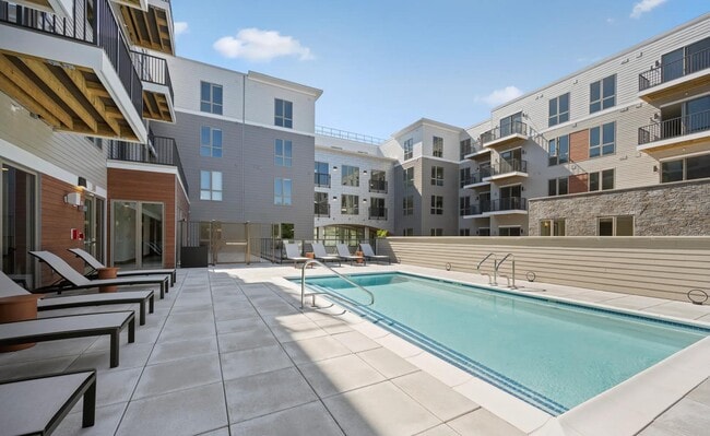Relax poolside at Modera Newton in Newton, MA.