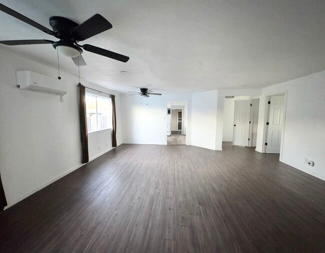 Main living area with natural light, new fans, mini split and view to the 2 front bedrooms & kitcs - 16060 39th Ave