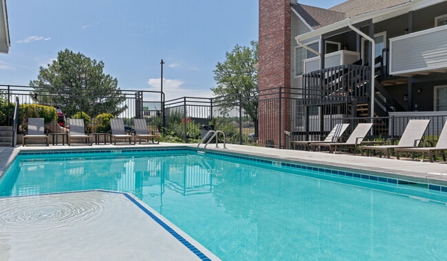 Cool off with a refreshing swim steps from home. - Skyview Apartment Homes