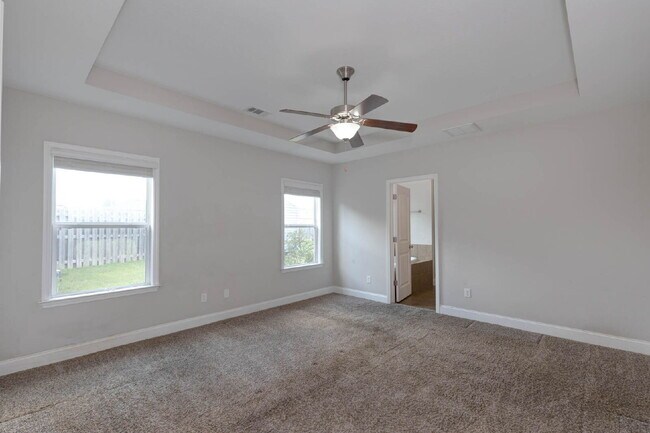 Photo - 4BR/3.5BA · 2,809 SF · Owner's Suite on Main · Fenced Yard · Midland, GA — $2,800/mo