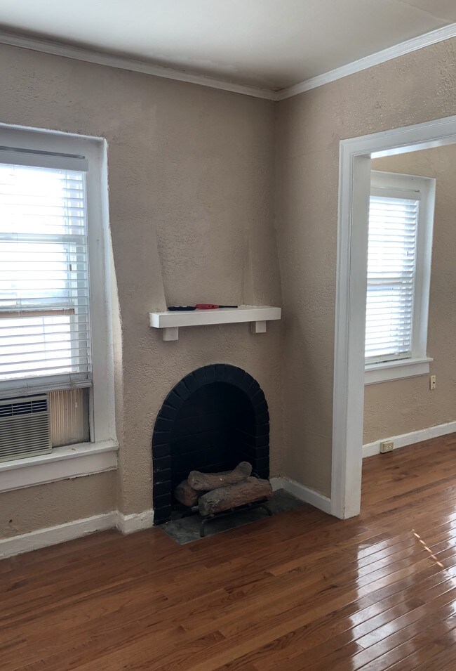 #105 Livingroom Fireplace - Windemere Court Apartments