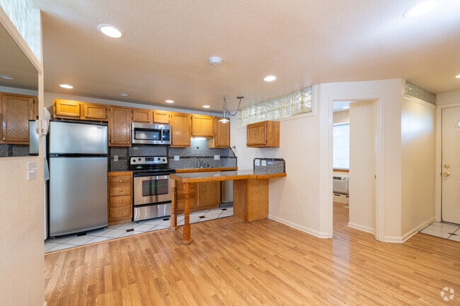 3BR, 2BA - 750SF - Kitchen & Living room