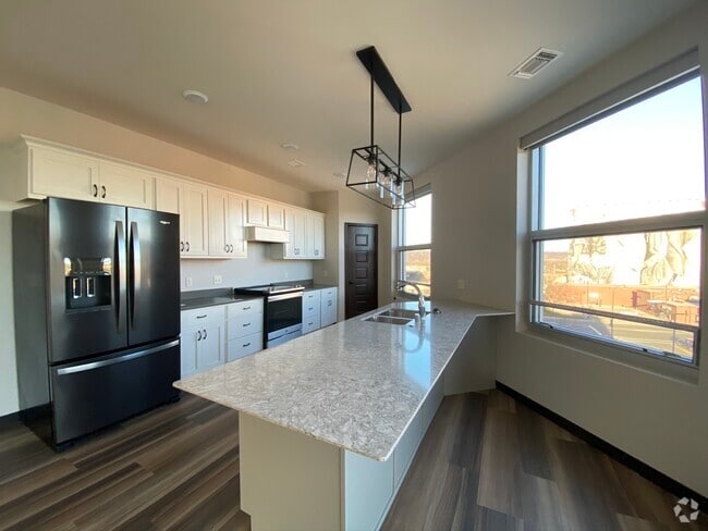 Fully equipped kitchen with Cambria countertops - Brennan Properties of Minnesota LLC Rental