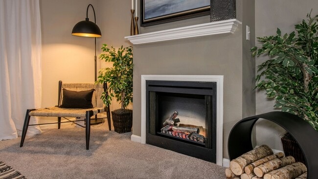 Delight in the warmth of a fireplace, adding a modern, cozy elegance to living spaces (in select homes).