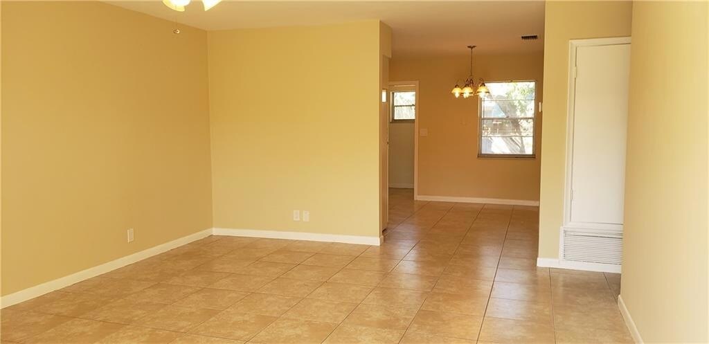 Bright living room with tile flooring - 981 NE 36th St Unit 1