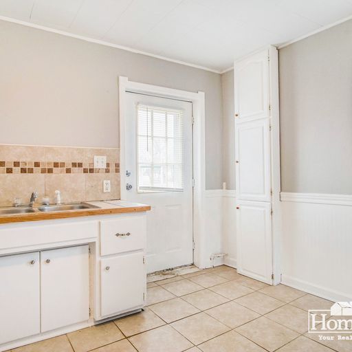 Photo - Charming two-bedroom, one-bath home offering a comfortable layout with ample natural light