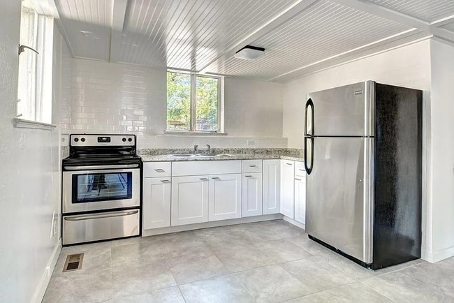 Photo - (PRE-LEASING 2026)   7 Bed 3 Bath Dual-Living Dream Duplex with Spacious Yards & Modern Upgrades