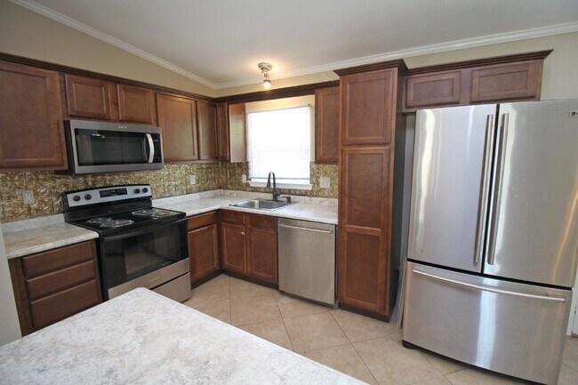 Photo - 4BR/2BA Central Pensacola Cottage with Open Living, Vaulted Ceilings, Stainless Appliances & Larg...