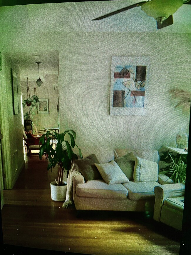 Den and hallway leading to eat in kitchen and full deck! Cook & enjoy in comfort on your deck! - 19 Ackley Pl Unit #2