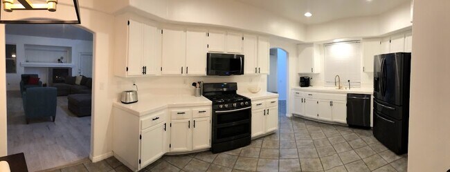 Kitchen fully equipped with appliances, cookware, and silverware for making meals at home a breeze.