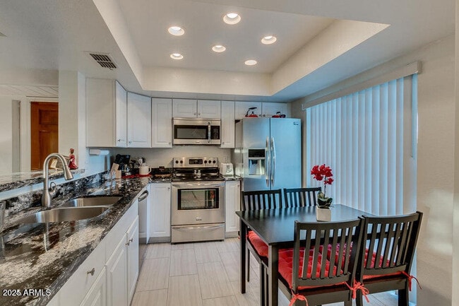 Building Photo - 9450 N 94th Pl Unit 210