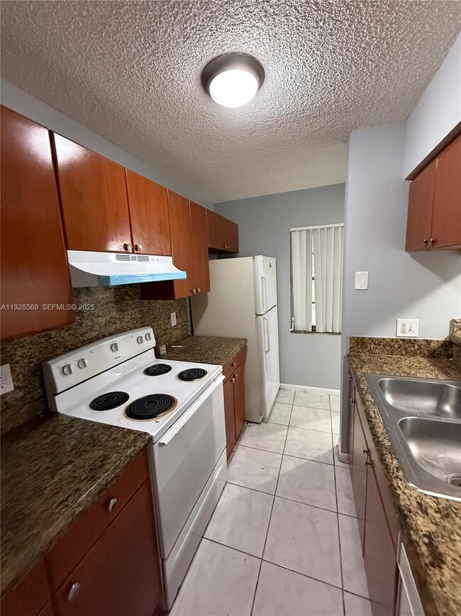 Building Photo - 11580 NW 43rd Ct Unit 11580