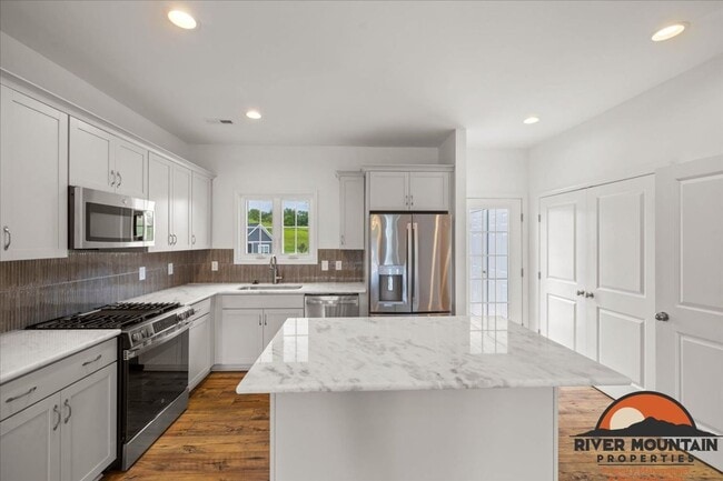 Photo - Well-Located Townhome with Private Off-Street Parking