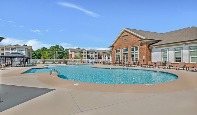 Enjoy premier amenities like a resort style pool with multiple cabanas and lounge chairs