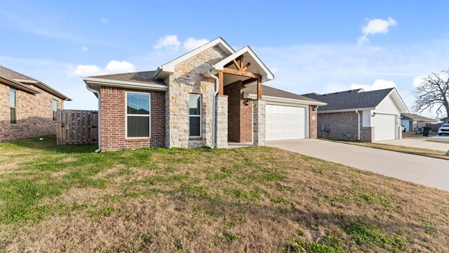 Photo - "Spacious 4-Bed Gem with Granite Elegance & Cozy Fireplace in Bentonville!"